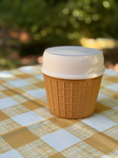 Portable Ice Cream Cooler with white lid on a checkered tablecloth, outdoors, ice cream portable cooler, ice cream pint cooler
